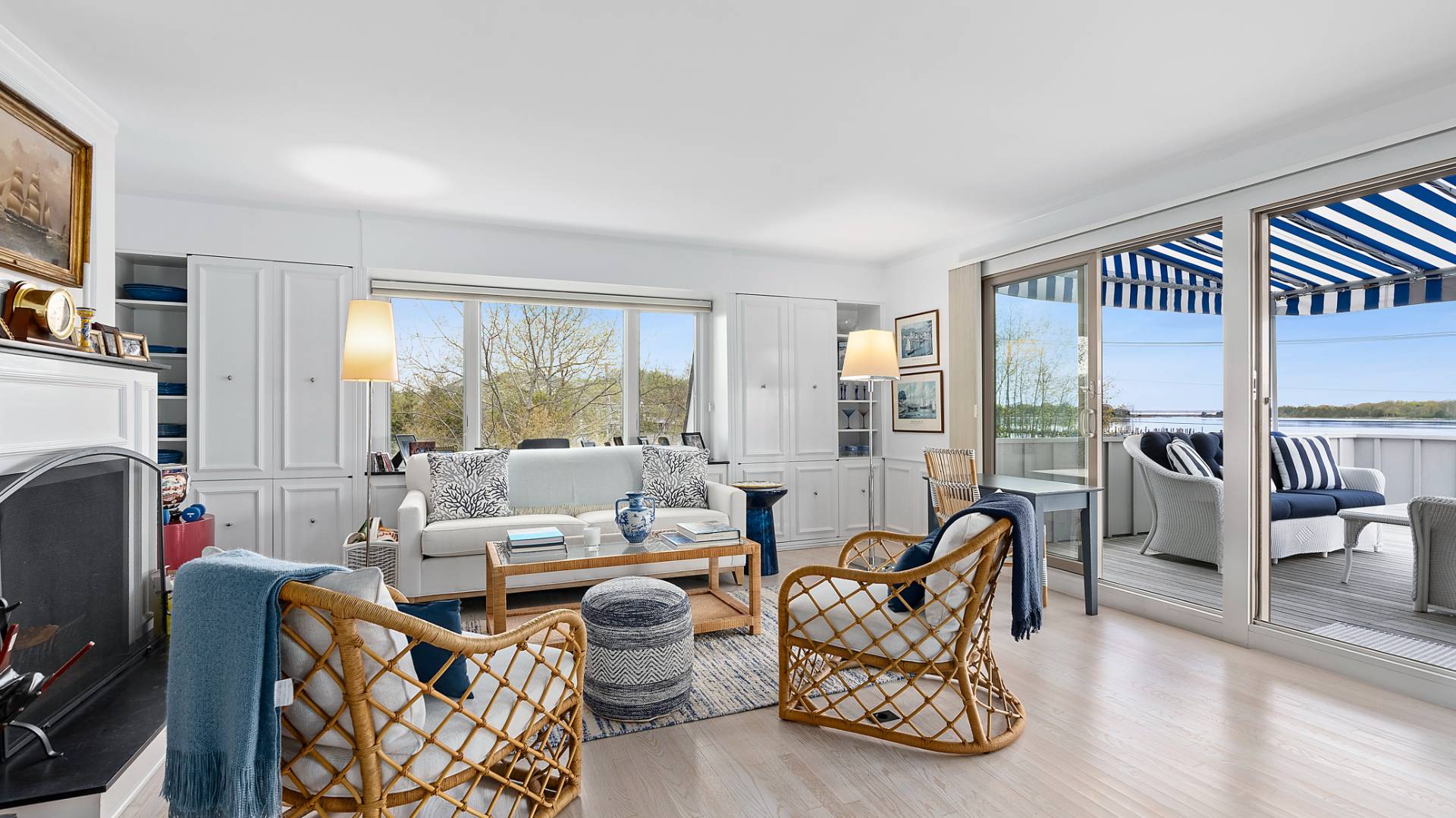18 Bridge Street, Unit 4D Sag Harbor, NY 11963 - Photo 10 of 16 a living room with furniture and a floor to ceiling window