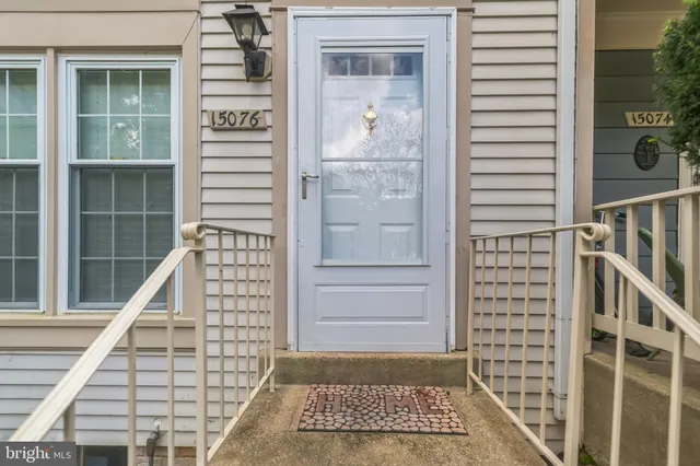 a view of a balcony with a door and a window