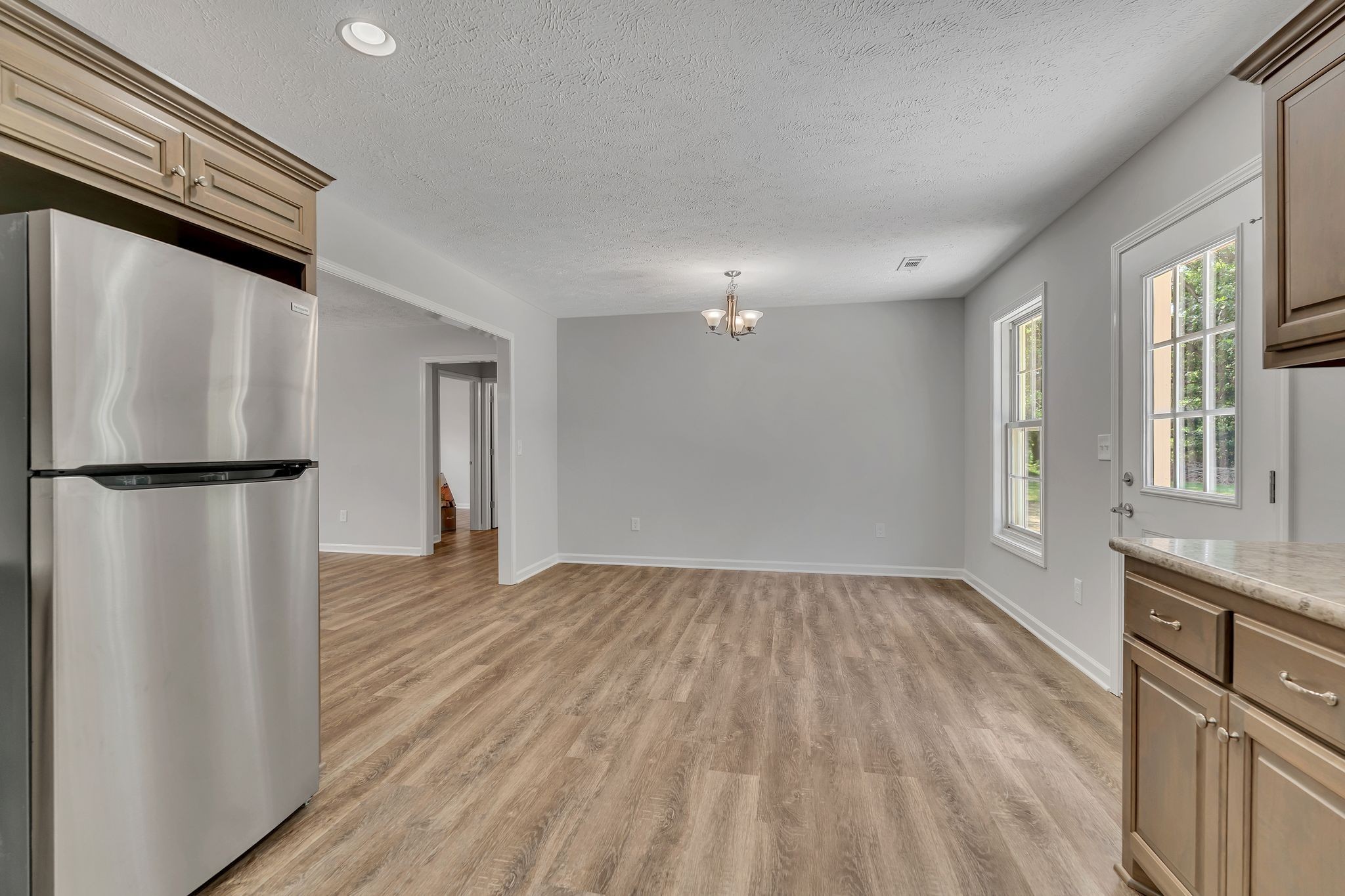 393 Flowertown Road Normandy, TN 37360 - Photo 17 of 34 a view of an empty room with wooden floor and a window