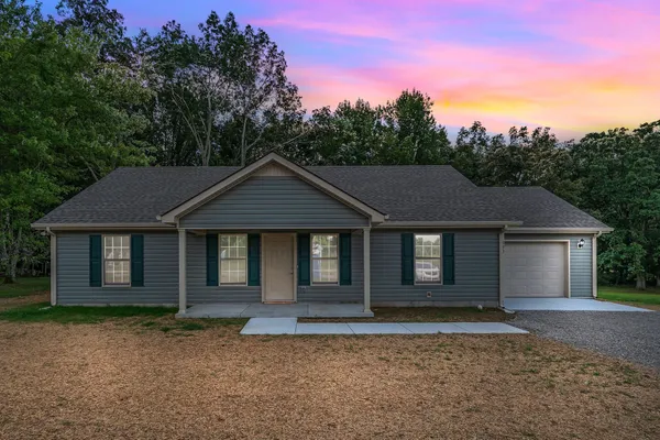 front view of a house with a yard