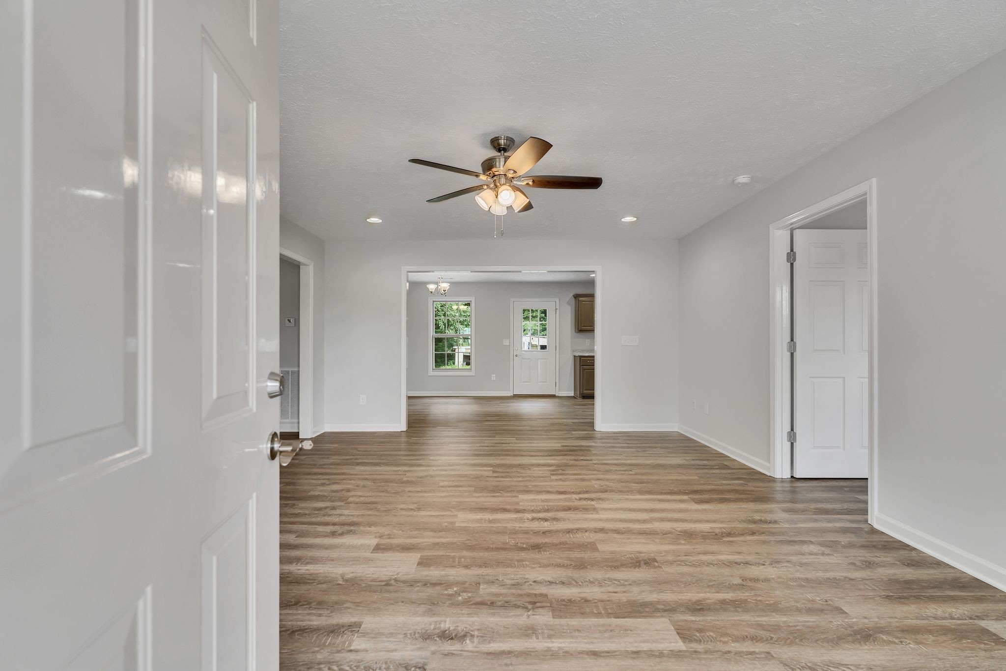 393 Flowertown Road Normandy, TN 37360 - Photo 5 of 34 a view of empty room with wooden floor and fan