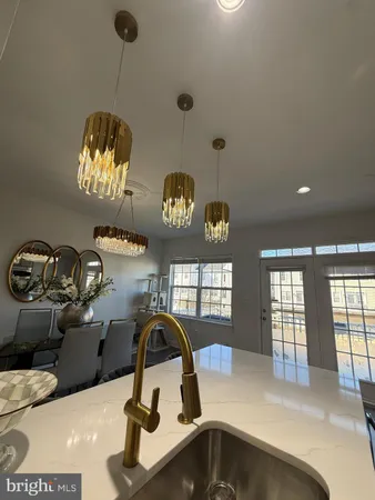 a bathroom with a sink and a large mirror