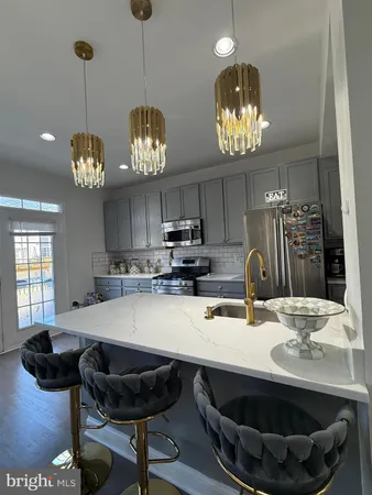 a kitchen with a table and chairs in it