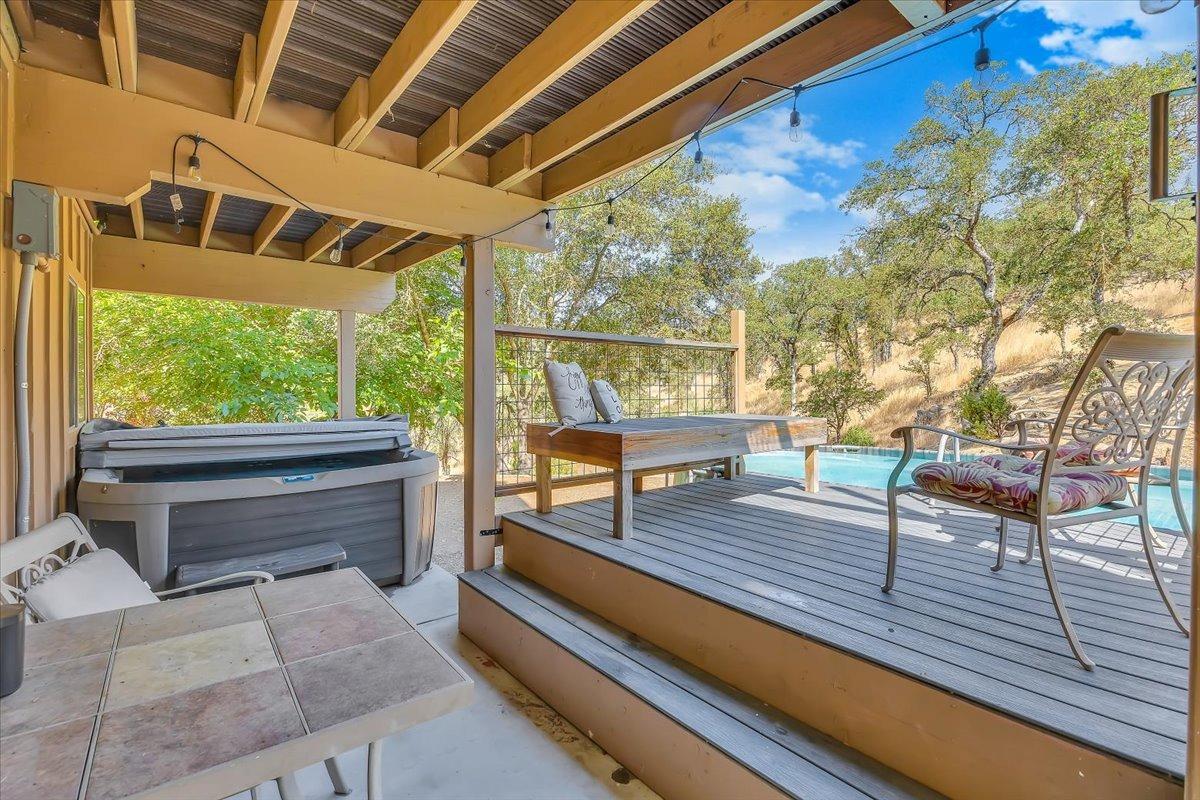 1499 Sawmill Road, Unit 594 Copperopolis, CA 95228 - Photo 55 of 98 Head out the slider to the covered back patio with steps up to the deck.