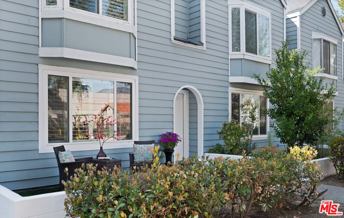 591 Garfield Avenue, Unit 5 Pasadena, CA 91101 - Photo 1 of 48 a front view of a house with a yard