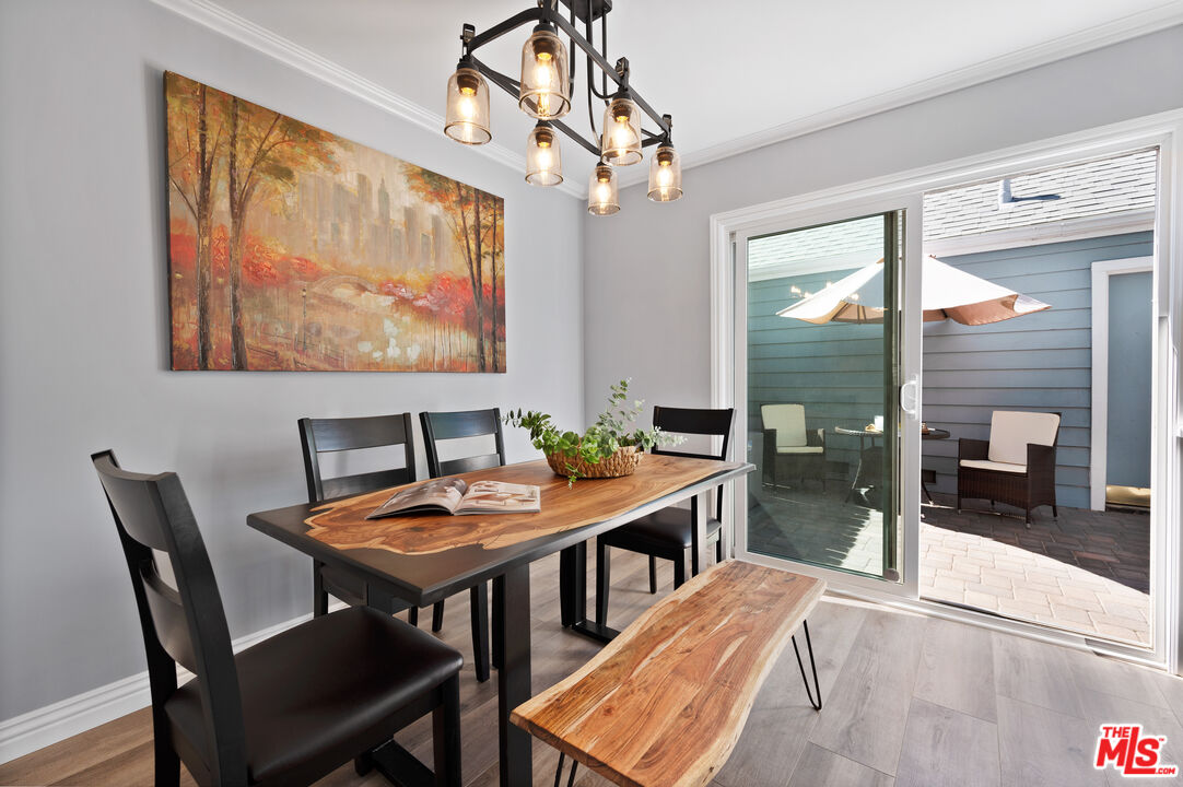 591 Garfield Avenue, Unit 5 Pasadena, CA 91101 - Photo 11 of 48 a view of a dining room with furniture and chandelier
