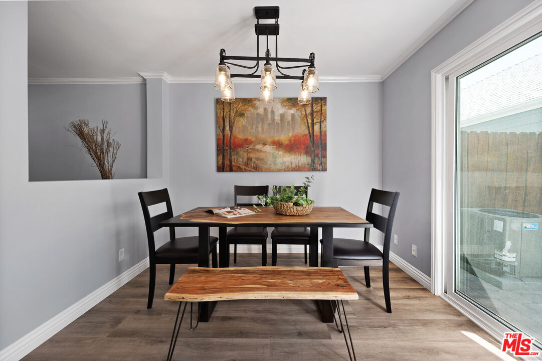 591 Garfield Avenue, Unit 5 Pasadena, CA 91101 - Photo 12 of 48 a view of a dining room with furniture window and wooden floor