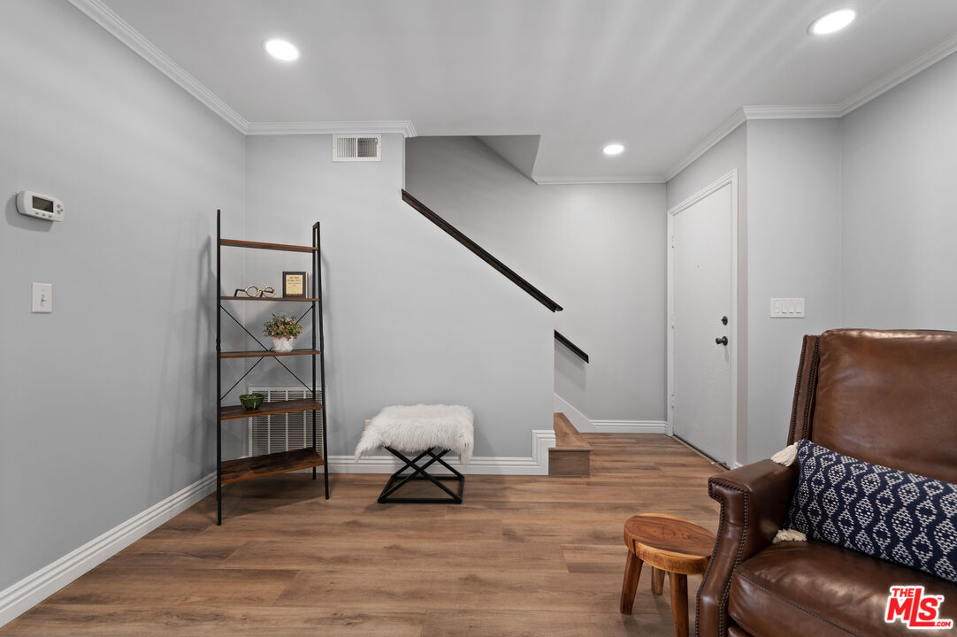 591 Garfield Avenue, Unit 5 Pasadena, CA 91101 - Photo 24 of 48 a living room with furniture and a painting on the wall