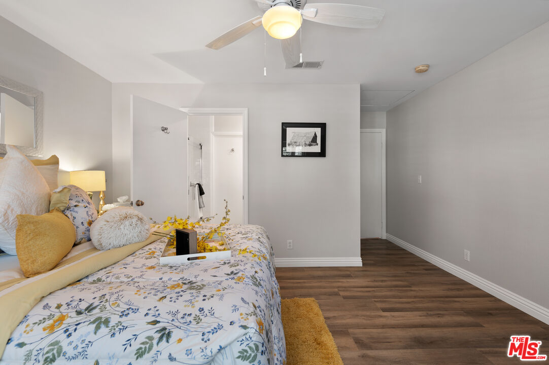 591 Garfield Avenue, Unit 5 Pasadena, CA 91101 - Photo 28 of 48 a bedroom with a bed and wooden floor