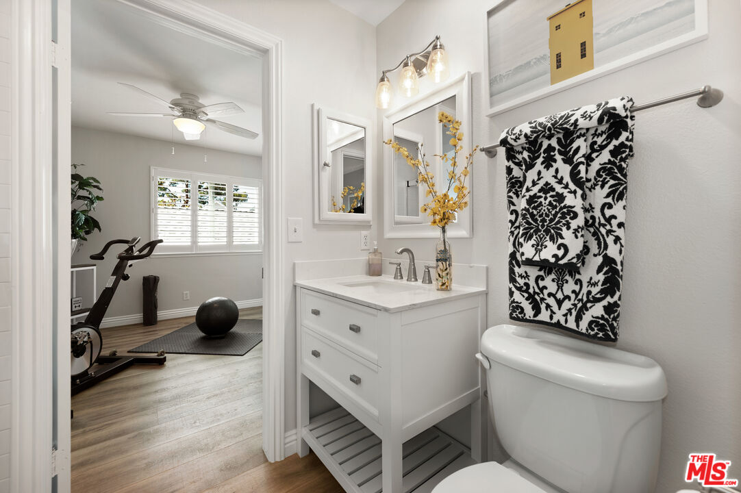 591 Garfield Avenue, Unit 5 Pasadena, CA 91101 - Photo 32 of 48 a bathroom with a sink toilet mirror and shower