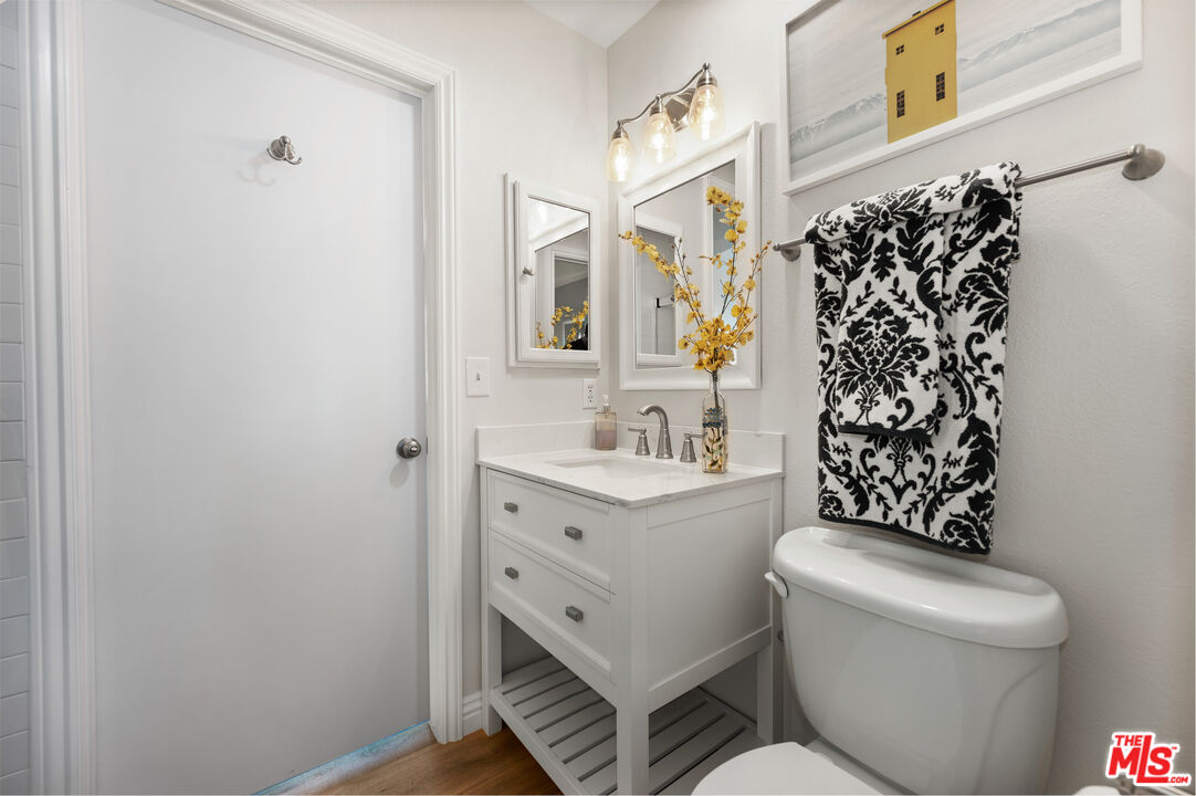 591 Garfield Avenue, Unit 5 Pasadena, CA 91101 - Photo 33 of 48 a bathroom with a sink toilet vanity and shower