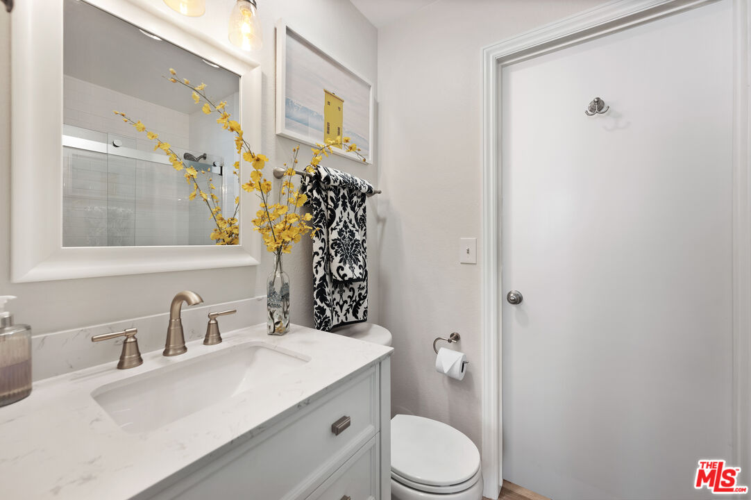 591 Garfield Avenue, Unit 5 Pasadena, CA 91101 - Photo 36 of 48 a bathroom with a sink a toilet and shower