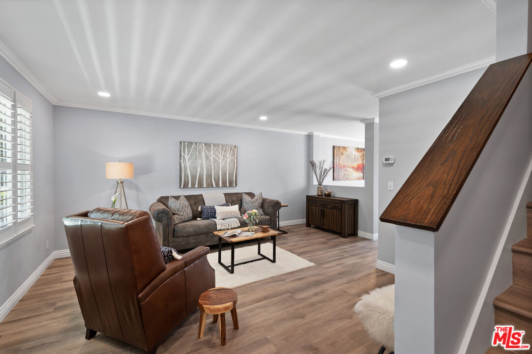 591 Garfield Avenue, Unit 5 Pasadena, CA 91101 - Photo 43 of 48 a living room with furniture and a wooden floor