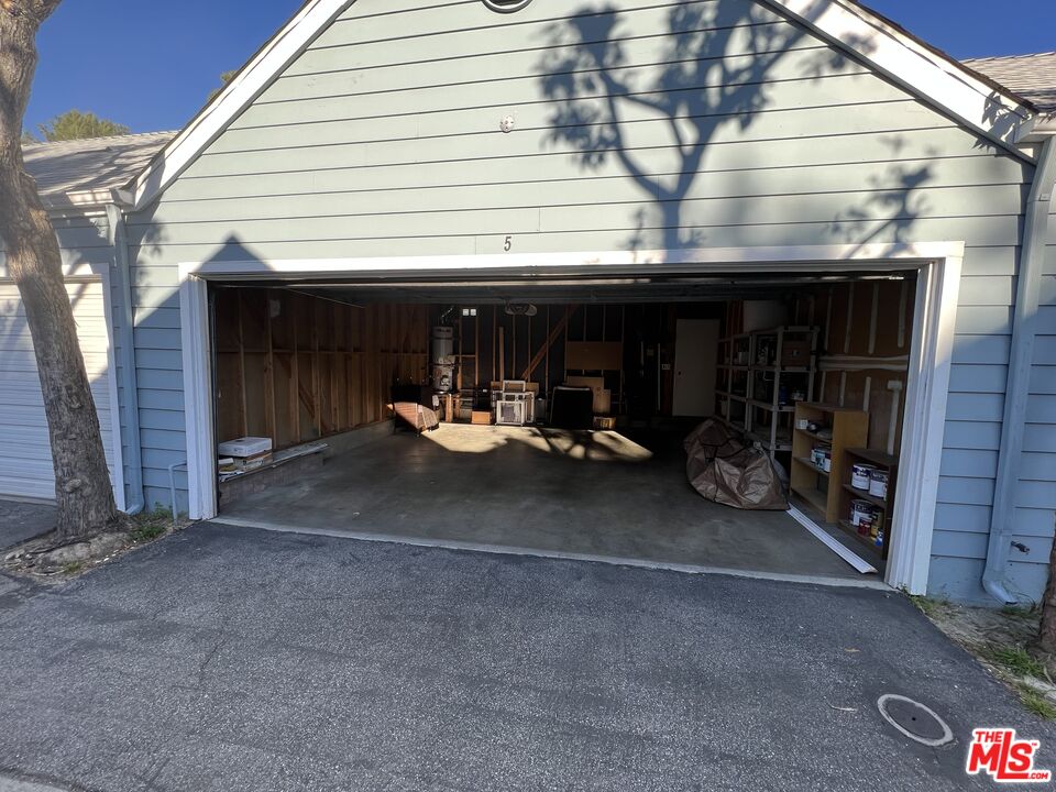 591 Garfield Avenue, Unit 5 Pasadena, CA 91101 - Photo 48 of 48 a view of a patio with table and chairs and a fire pit