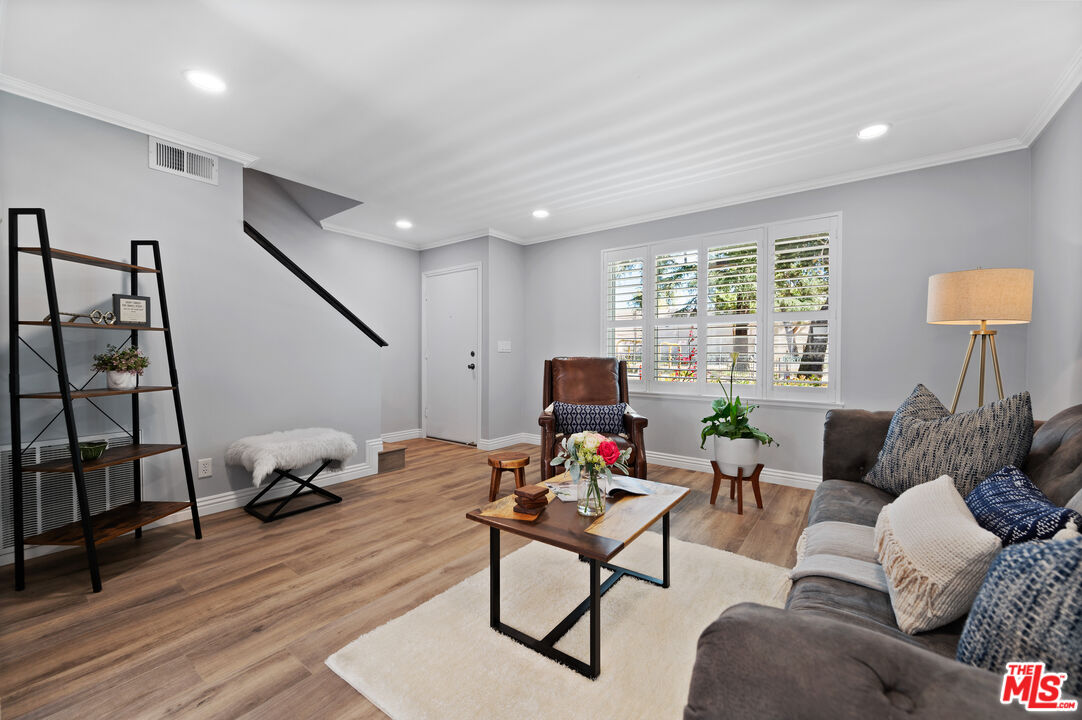 591 Garfield Avenue, Unit 5 Pasadena, CA 91101 - Photo 8 of 48 a living room with furniture and a flat screen tv