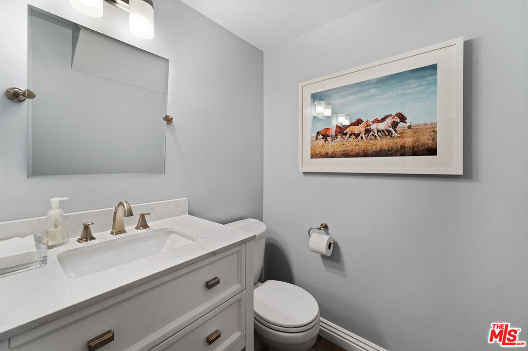 591 Garfield Avenue, Unit 5 Pasadena, CA 91101 - Photo 10 of 48 a bathroom with a sink mirror and toilet