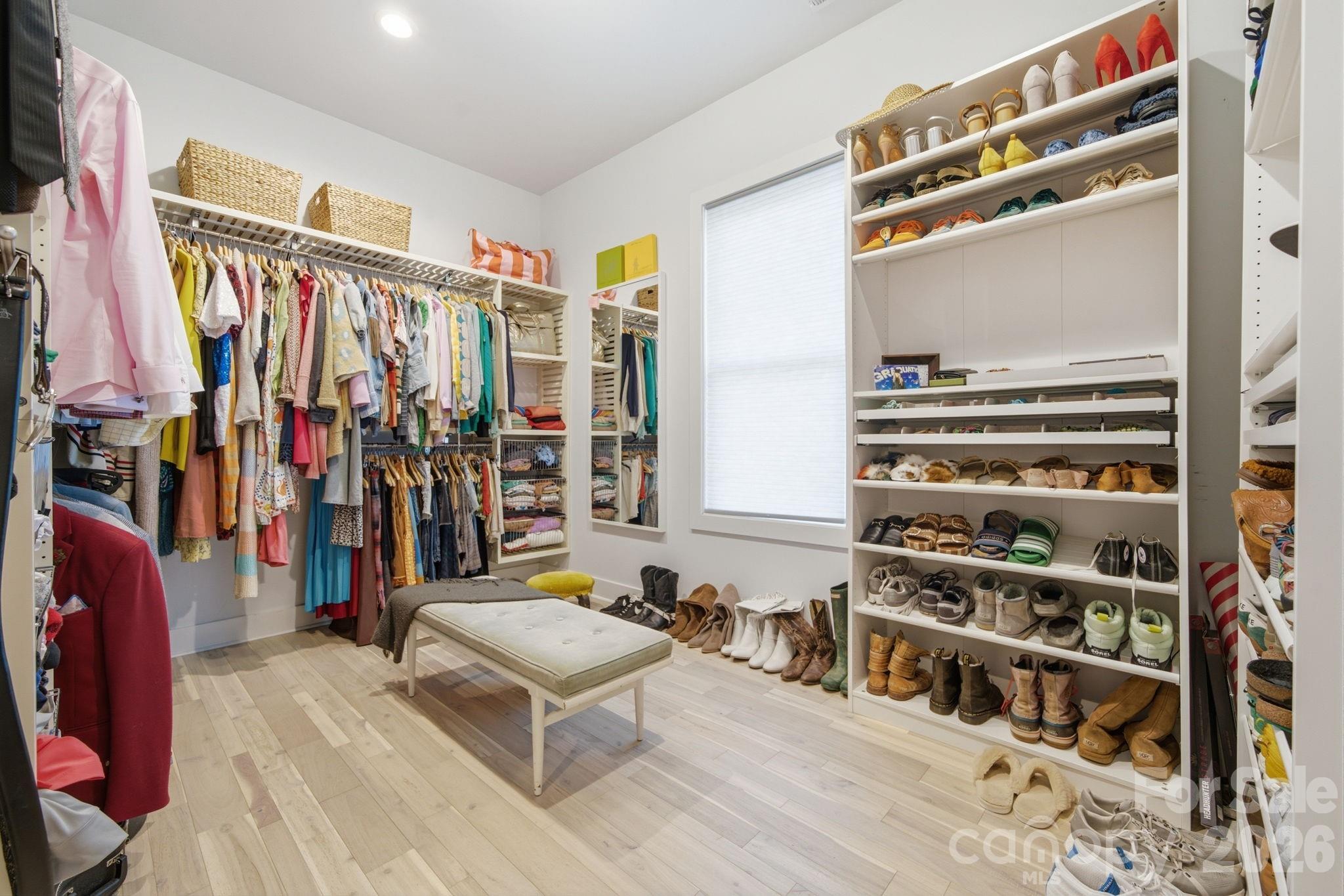 6816 West Duncan Road Indian Trail, NC 28079 - Photo 27 of 38 a view of walk in closet with clothes and shoes
