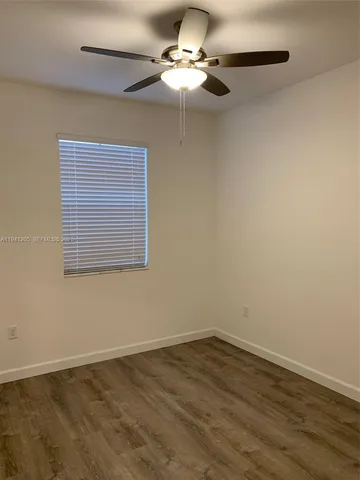 a view of a room that has a window in it