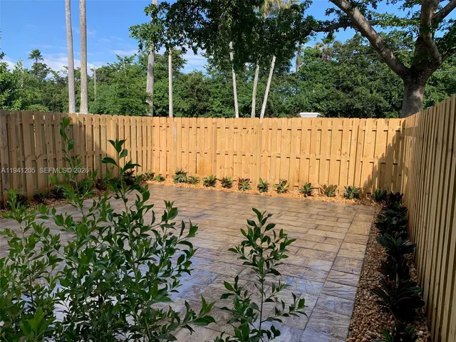 a view of a garden with a sitting area
