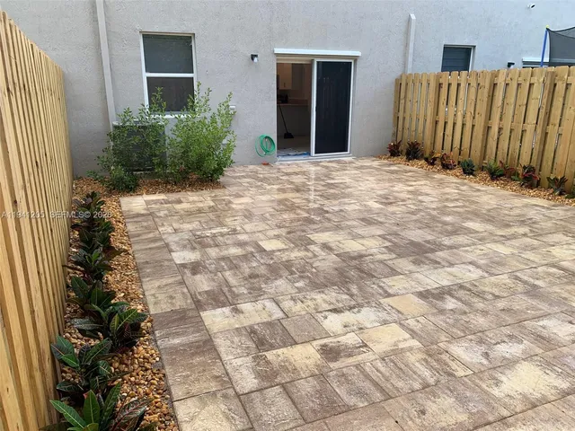 a view of a backyard of a house