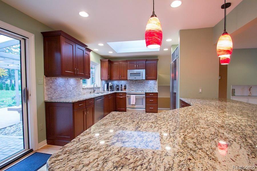 33705 Quaker Valley Road Farmington, MI 48331 - Photo 2 of 27 Updated kitchen, granite counters, fresh, open, every cook's dream kitchen