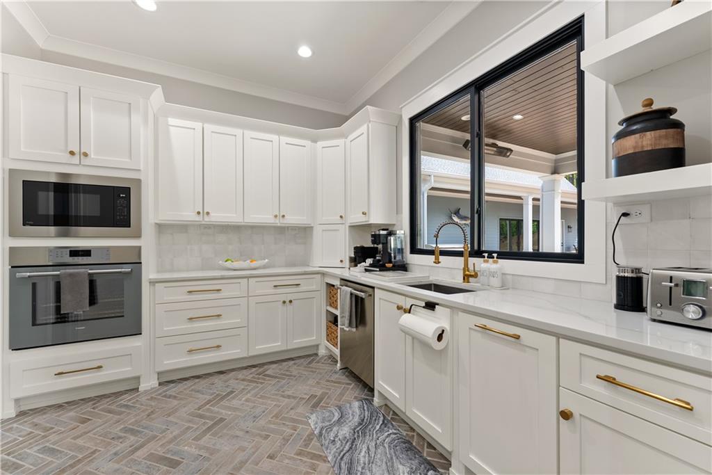 373 Fortress Way Jefferson, GA 30549 - Photo 40 of 118 a kitchen with a stove oven and sink