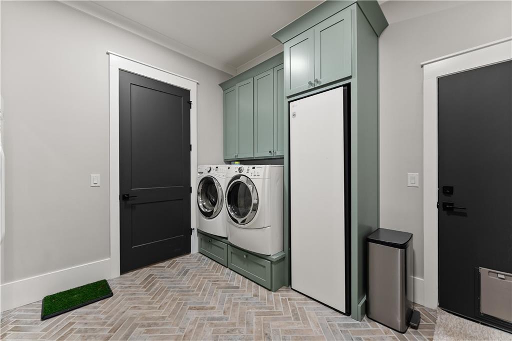 373 Fortress Way Jefferson, GA 30549 - Photo 46 of 118 a view of a storage and utility room with washer and dryer