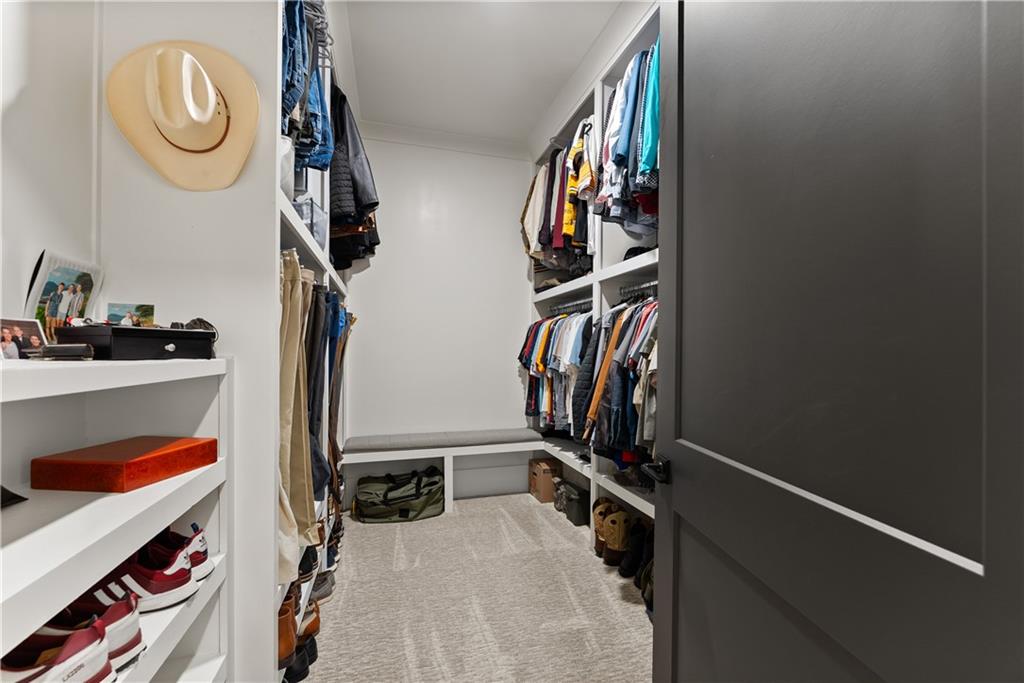 373 Fortress Way Jefferson, GA 30549 - Photo 48 of 118 a view of walk in closet with clothes and shoes