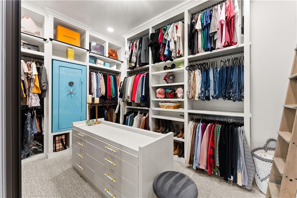 373 Fortress Way Jefferson, GA 30549 - Photo 54 of 118 a view of walk in closet with clothes and shoes