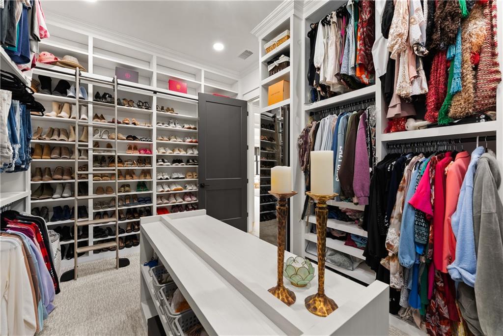373 Fortress Way Jefferson, GA 30549 - Photo 55 of 118 a view of walk in closet with clothes and shoes