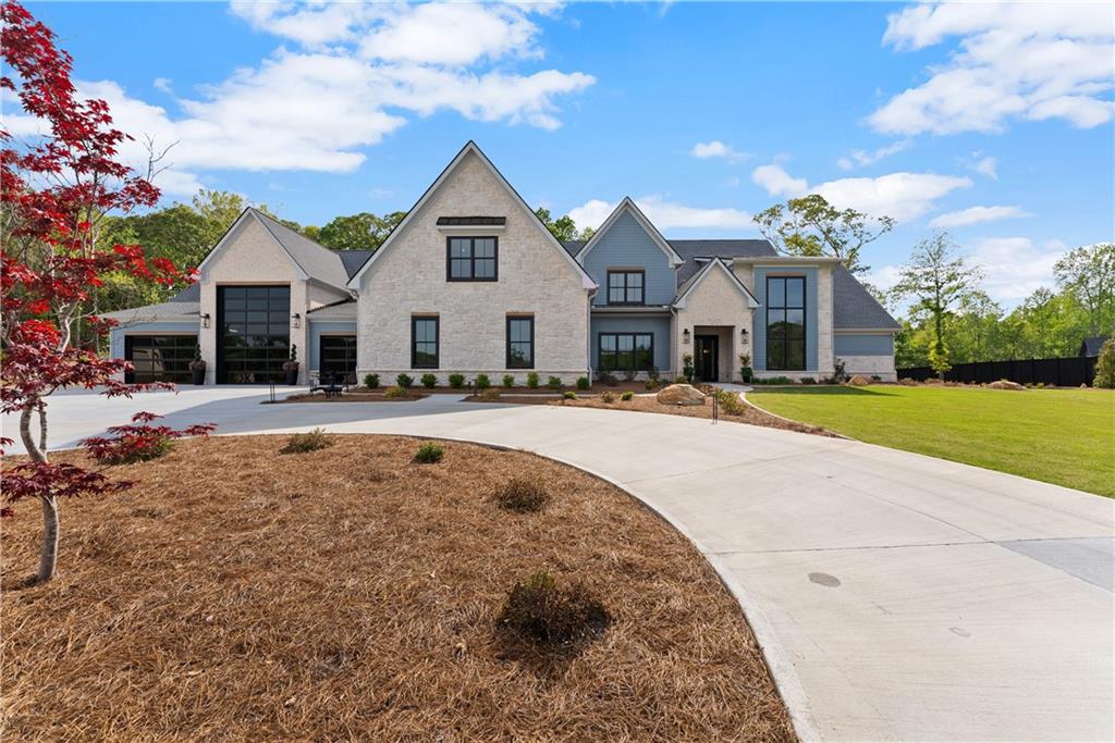 373 Fortress Way Jefferson, GA 30549 - Photo 6 of 118 a view of a white house with a swimming pool