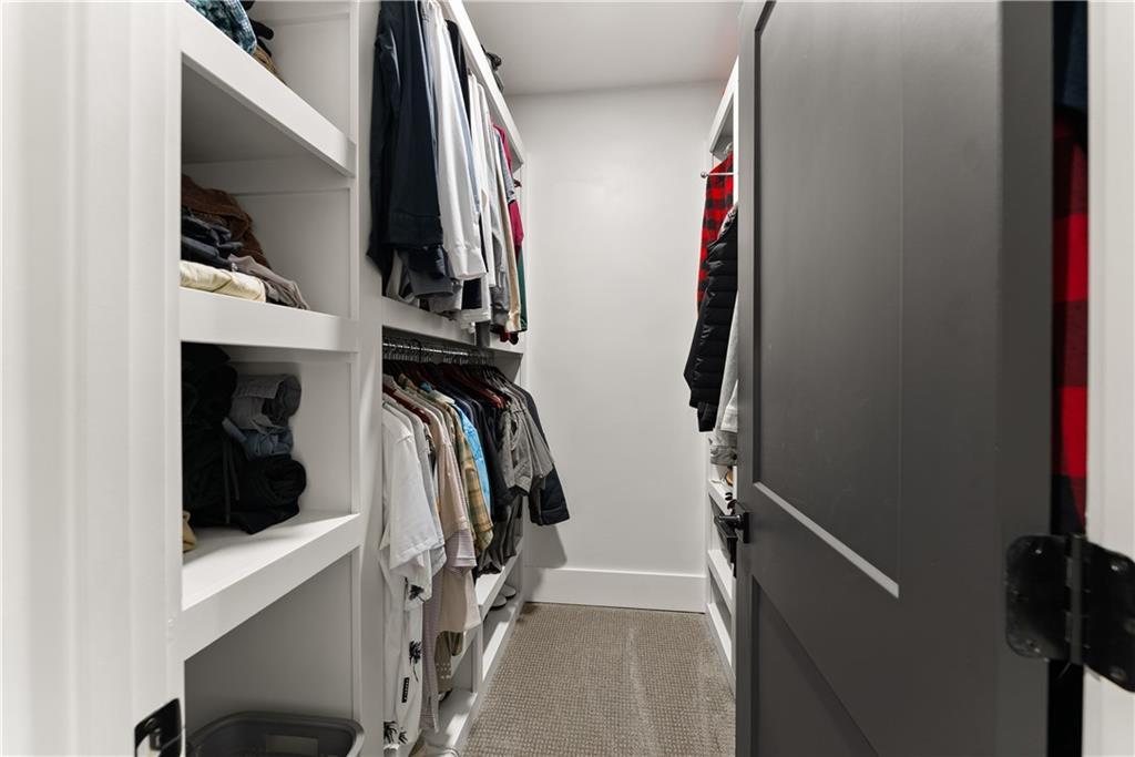 373 Fortress Way Jefferson, GA 30549 - Photo 68 of 118 a view of walk in closet with clothes and shoes