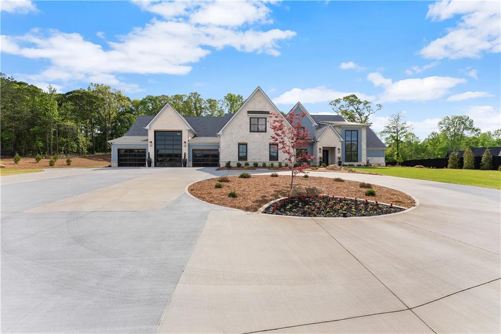 373 Fortress Way Jefferson, GA 30549 - Photo 7 of 118 a view of a white house with a swimming pool and a chairs