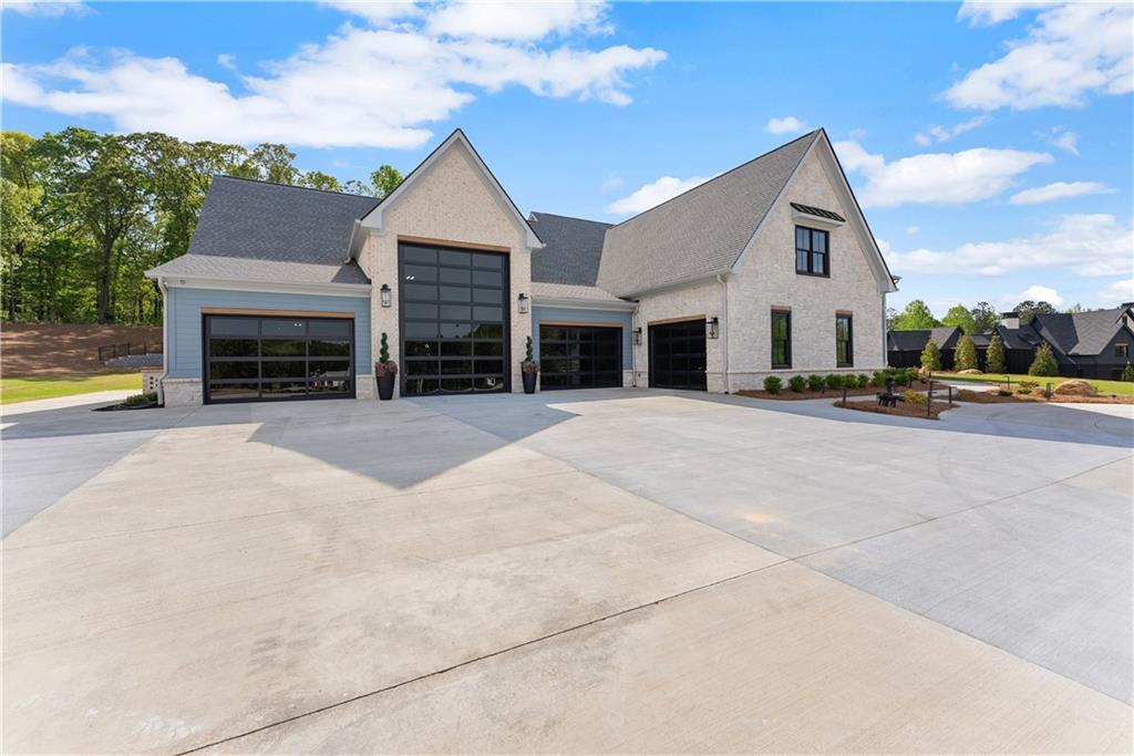 373 Fortress Way Jefferson, GA 30549 - Photo 8 of 118 a view of house with outdoor space and parking