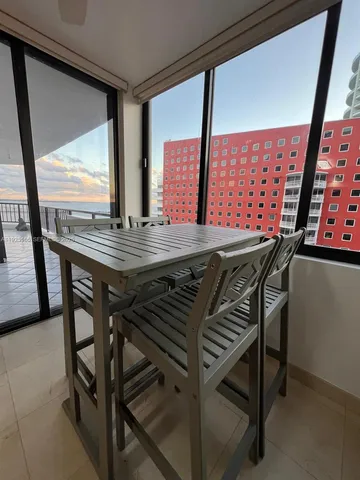 a view of an outdoor dining space with furniture
