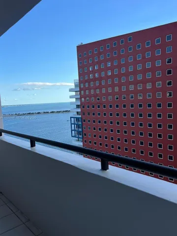 a bedroom with a bed furniture and a flat screen tv