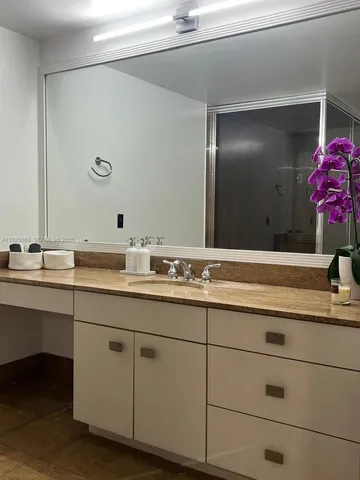 a living room with furniture and a mirror