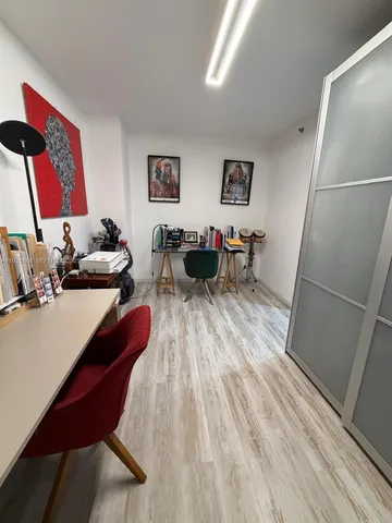 a bathroom with a granite countertop double vanity sink and mirror