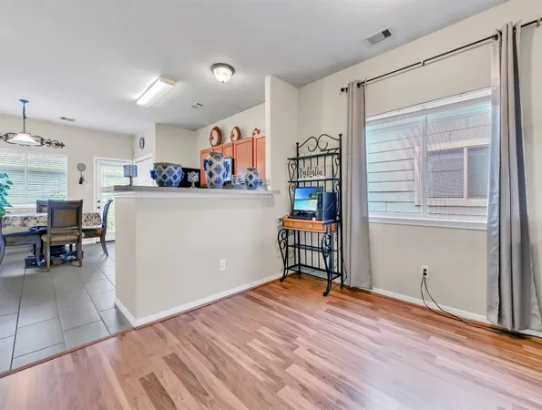 a kitchen with cabinets and window