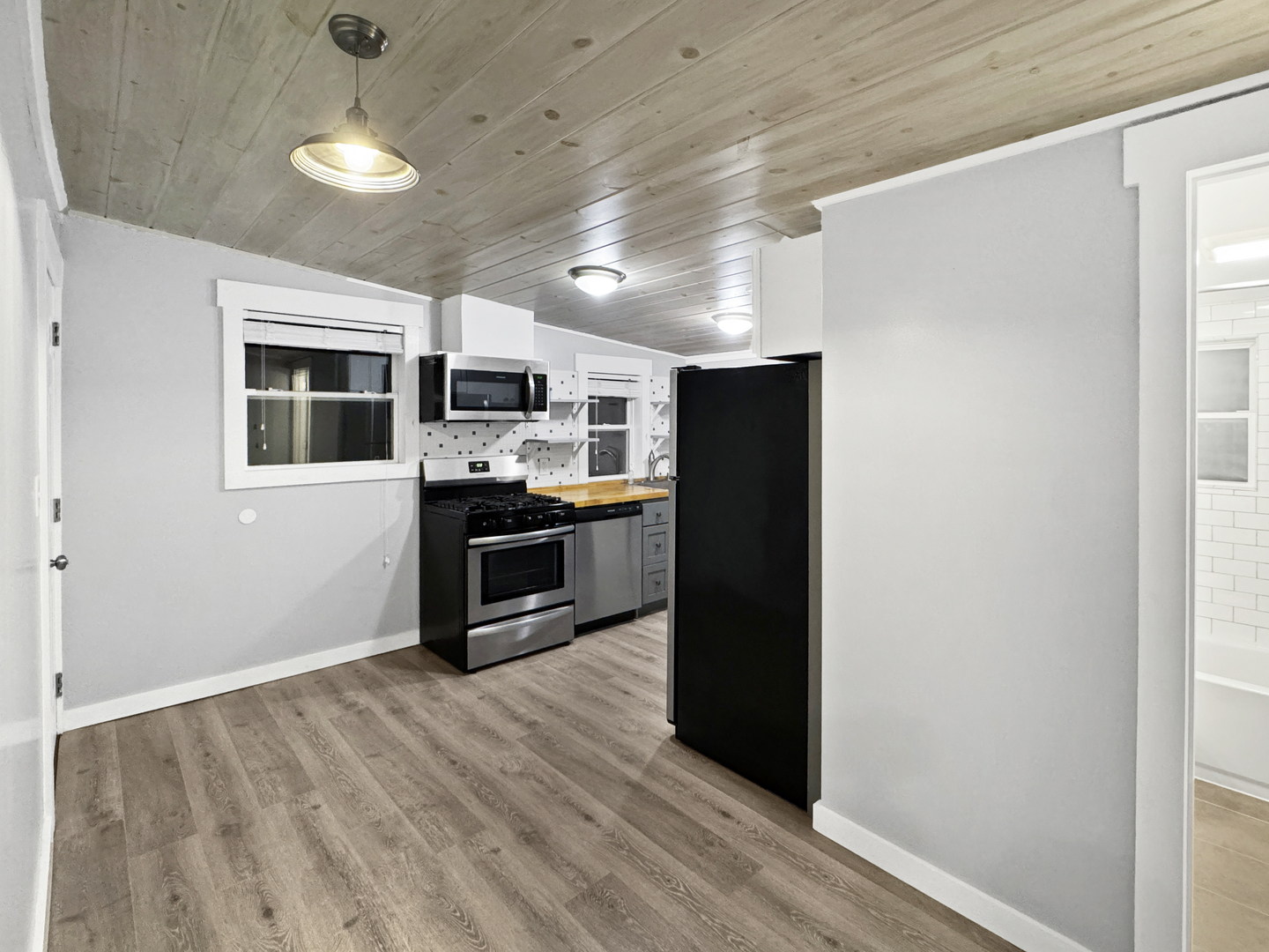 200 East Grove Street Utica, IL 61373 - Photo 14 of 41 a kitchen with stainless steel appliances granite countertop a refrigerator and a stove top oven