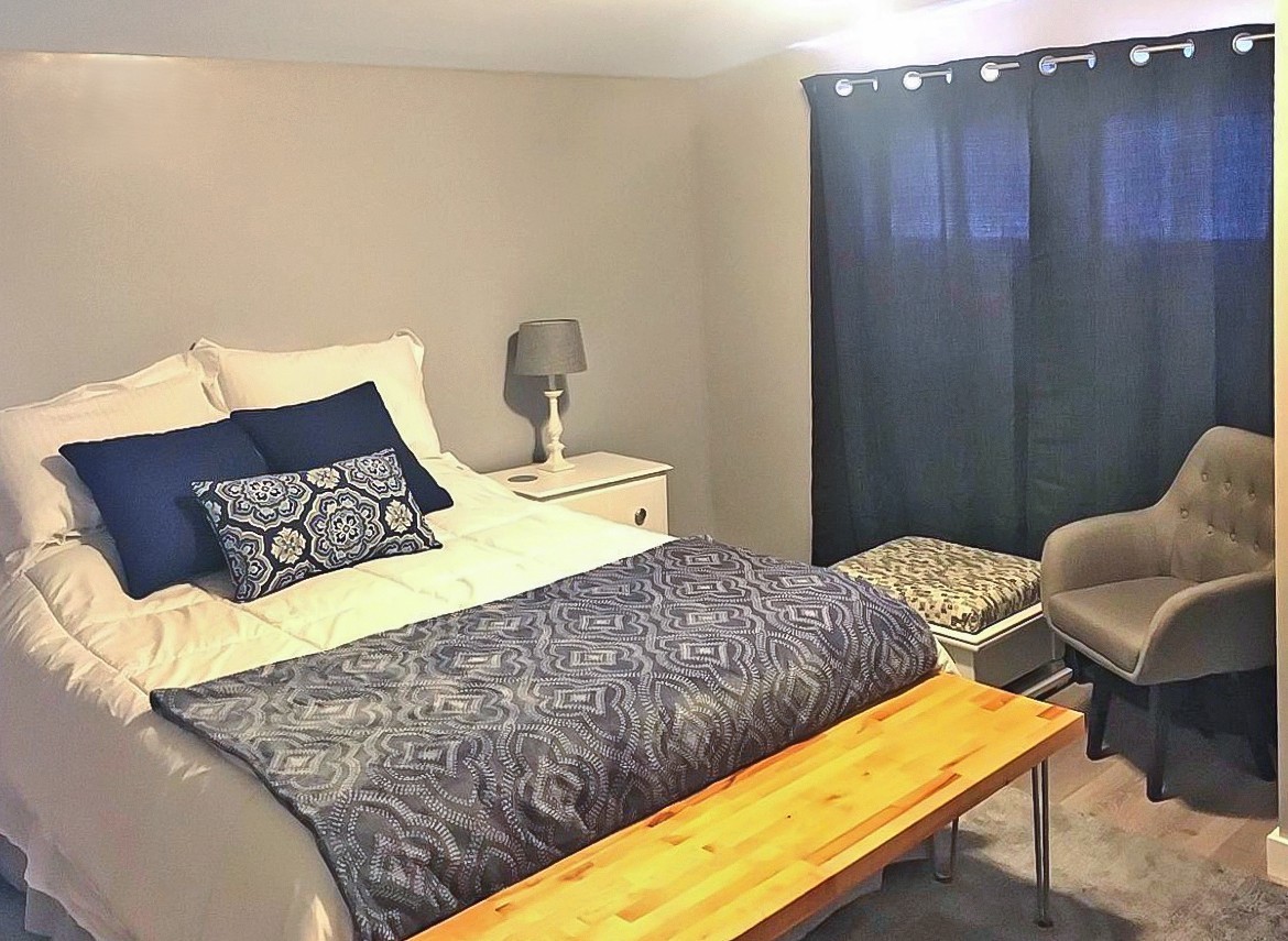 200 East Grove Street Utica, IL 61373 - Photo 17 of 41 a bedroom with a bed and chair