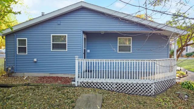 a front view of a house with a fence