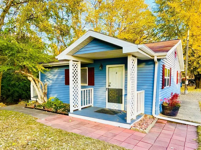 a front view of a house with a porch