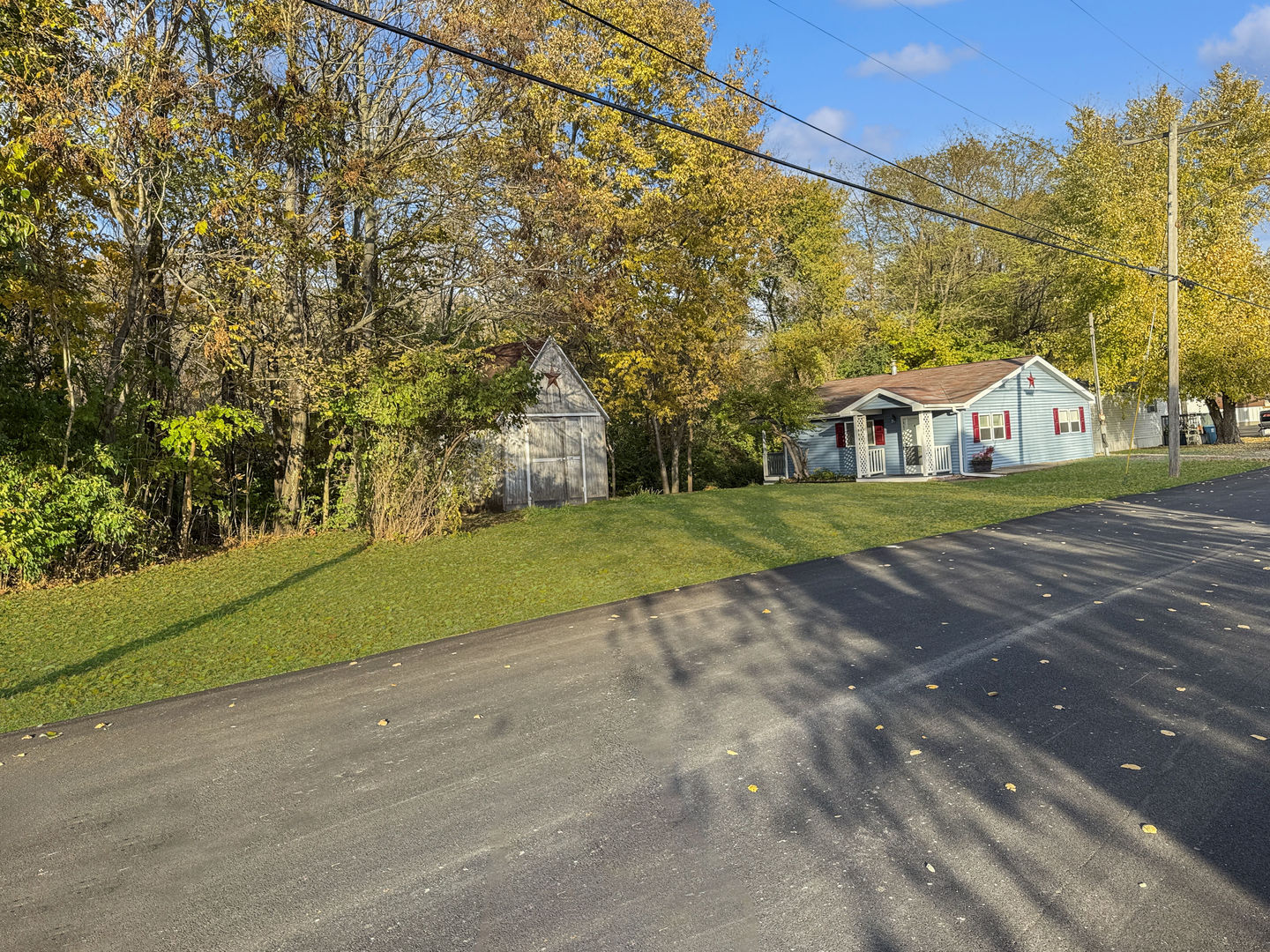 200 East Grove Street Utica, IL 61373 - Photo 41 of 41 a view of an house with backyard and trees