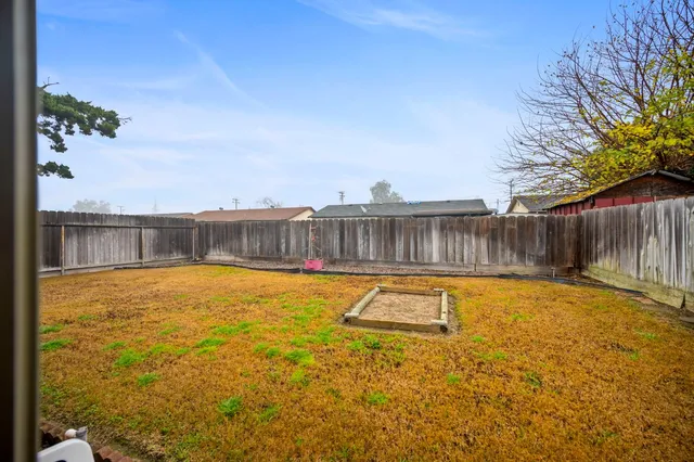 a swimming pool with wooden fence