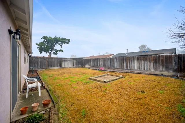 a swimming pool with wooden fence