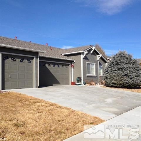 7623 La Ramba Drive Sparks, NV 89436 - Photo 1 of 1 a front view of a house with a yard and garage