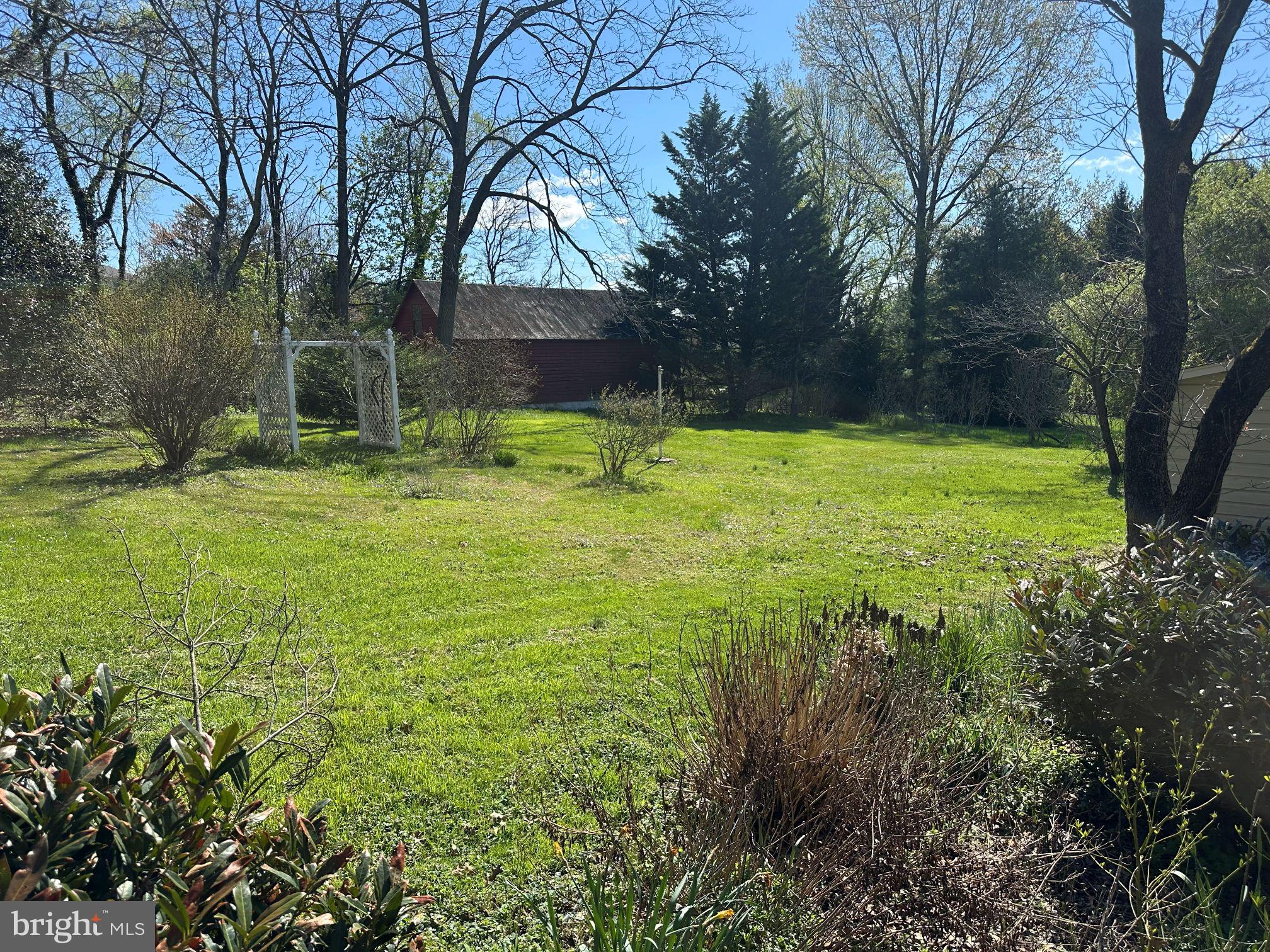 1974 Yingling Drive Spring Grove, PA 17362 - Photo 6 of 6 a backyard of a house with trees and outdoor seating