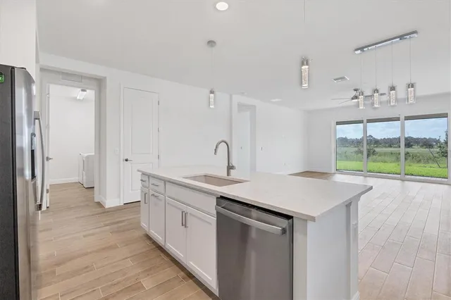 a kitchen with a sink and cabinets