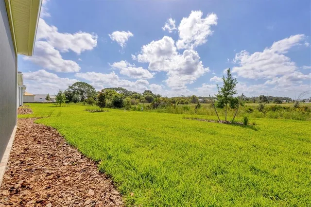 a view of a lake with a big yard